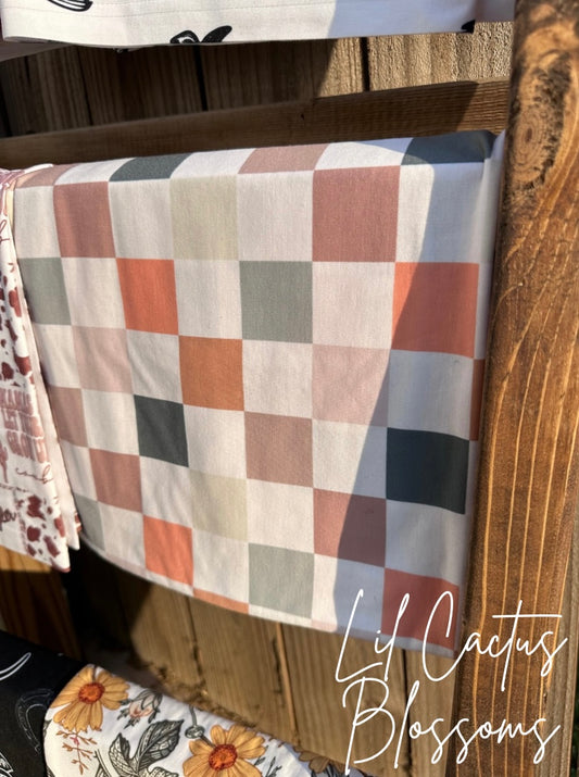 Muted Checkers Swaddle